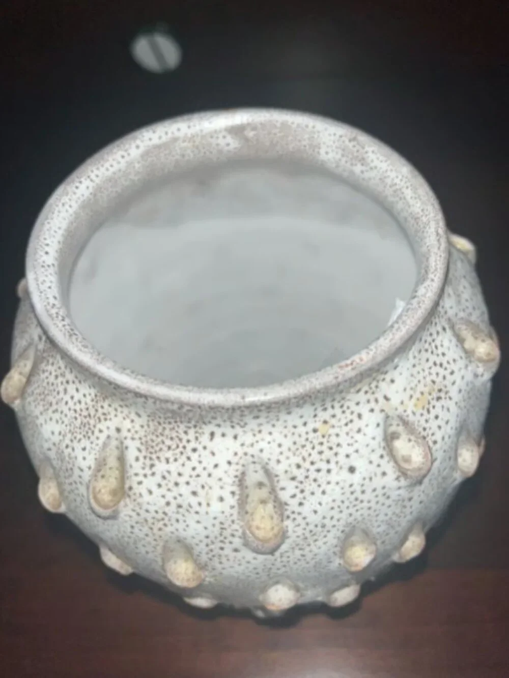Ceramic vase with white speckled teardrop-shaped patterns